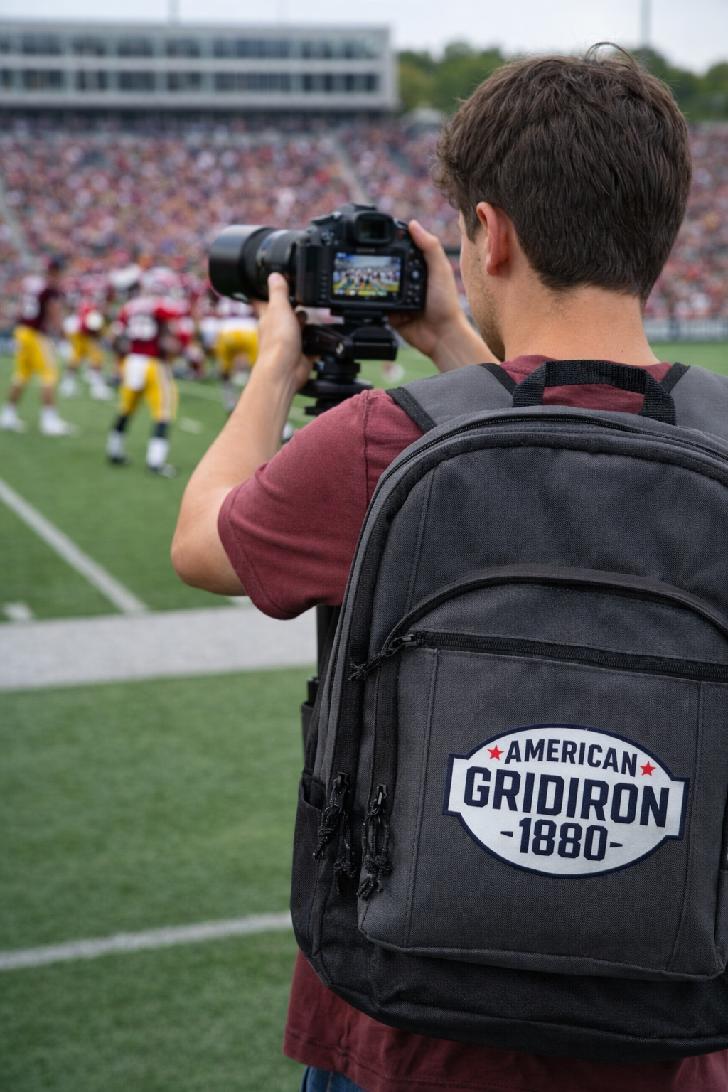 Campus Captain filming on the sideline of a college football game